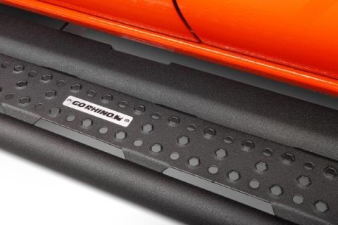 Dominator Xtreme D6 SideSteps Cab Length Body Mount Rock Slider with a wide step With Frame Mounted Bracket Kit Textured Black 2018-2026 Jeep Wrangler Go Rhino